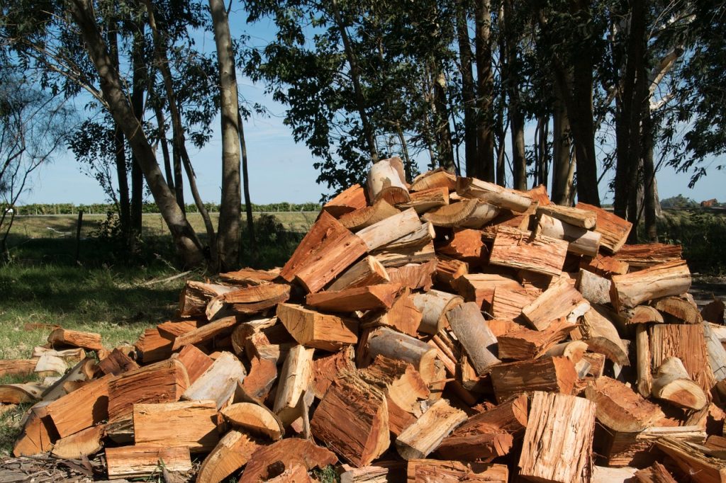 Recycled tree waste piled up in logs for the land owner.
